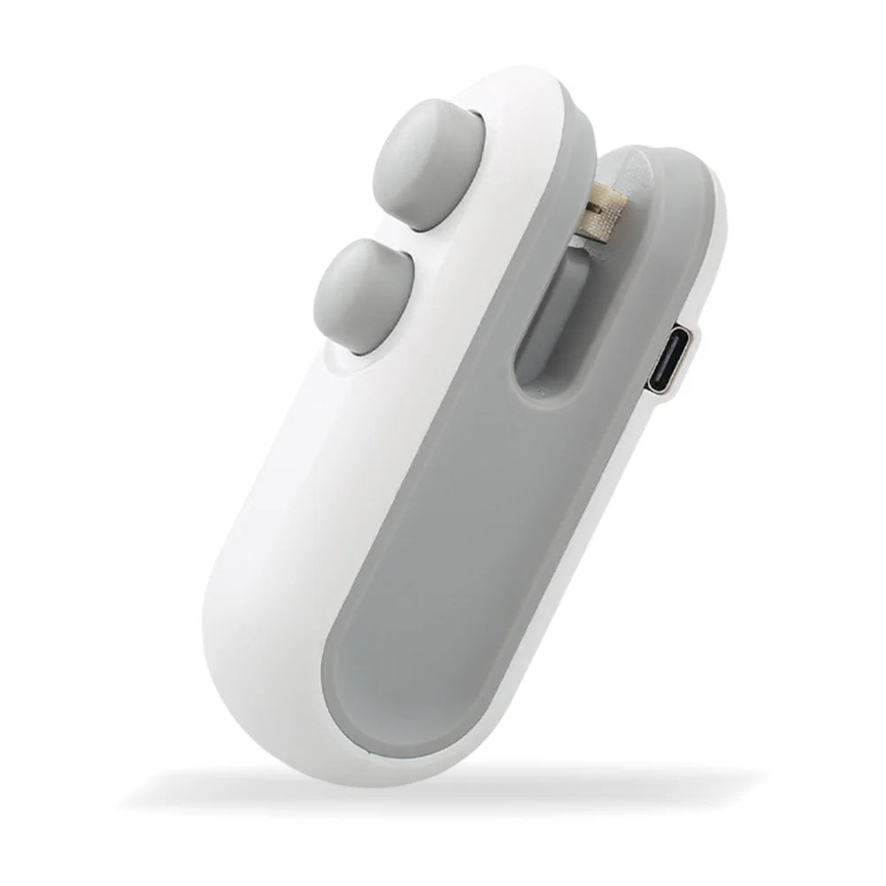 A white and gray 2-in-1 handheld bag sealer and cutter device shown from above.