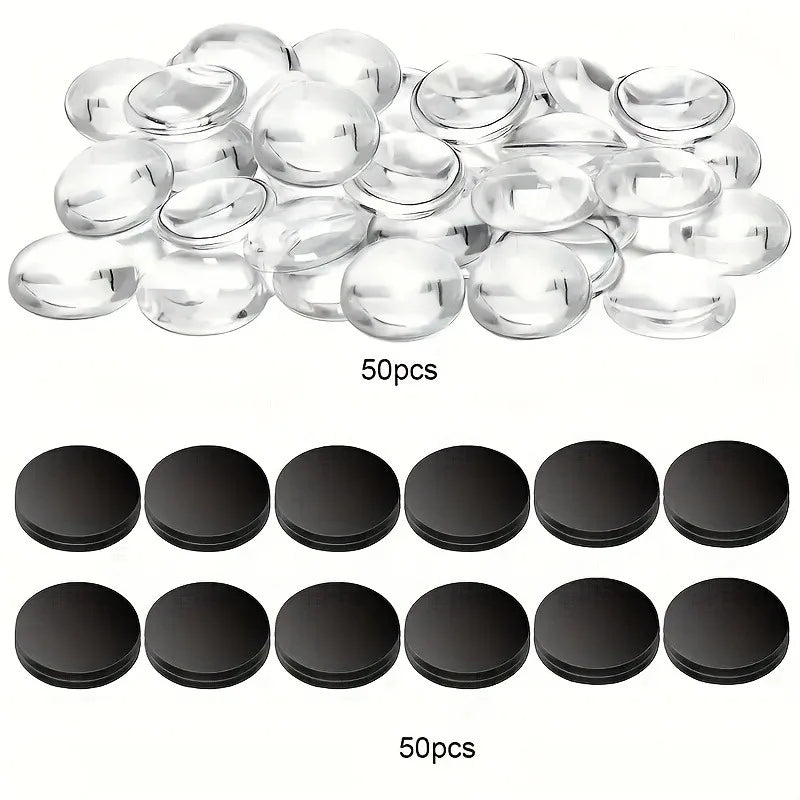 A collection of clear glass refrigerator magnets and black circular magnets are displayed.