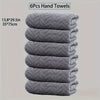 A stack of six gray quilted hand towels, measuring 13.8x29.5 inches each.
