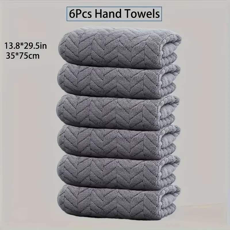 A stack of six gray quilted hand towels, measuring 13.8x29.5 inches each.