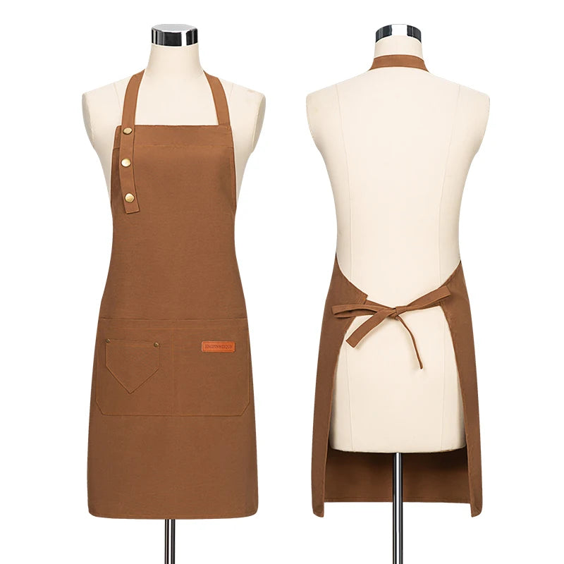 A brown canvas apron with adjustable straps displayed on a mannequin.