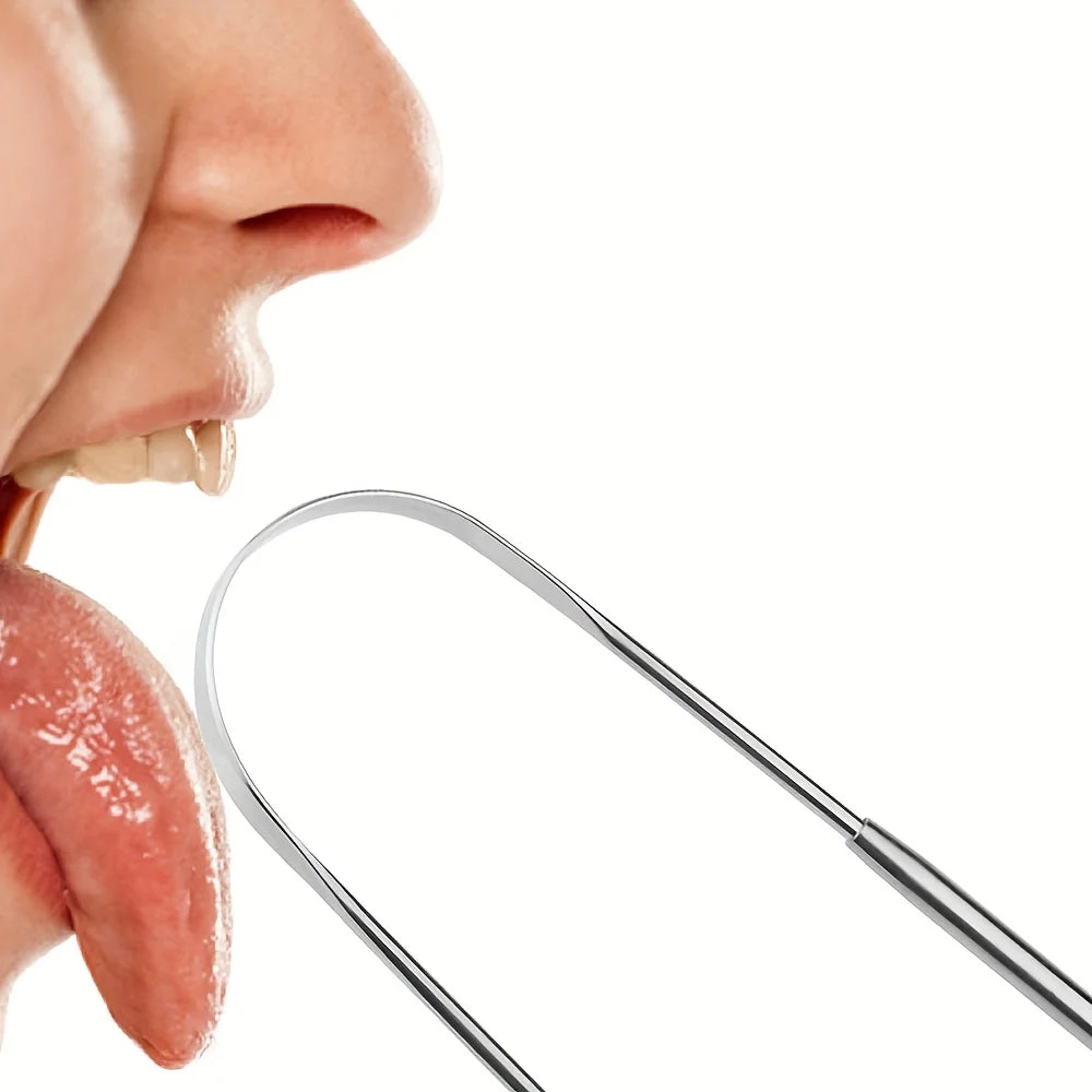 A stainless steel tongue scraper is shown next to a person's mouth.