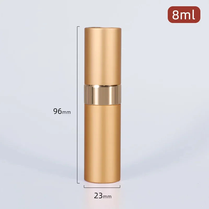 A tall, cylindrical gold-colored perfume spray bottle with a silver band and a 8ml capacity label.
