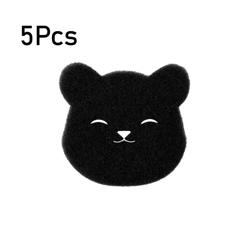 A small, black, fuzzy cat-shaped pet hair remover sponge.