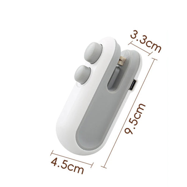 A white handheld bag sealer and cutter device shown from the side with dimensions marked.