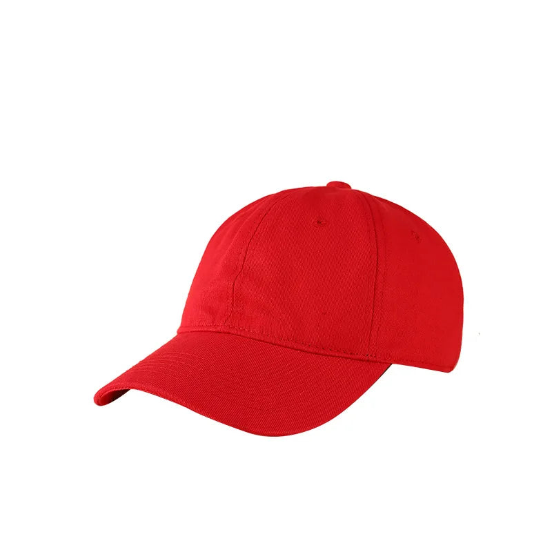 A solid red customizable cotton baseball cap viewed from the side.