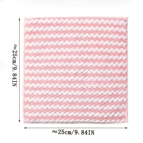 A square pink cleaning cloth with a white wavy pattern, measuring approximately 25cm by 9.84 inches.