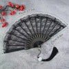 Black lace fabric folding hand fan with red flowers and measurement lines