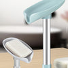 A light blue leaf-shaped suction cup soap dish with a silver stand and white bar soap.