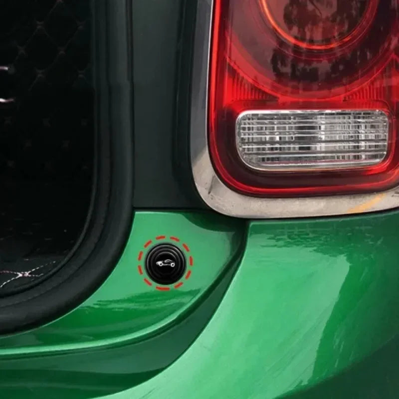 Close-up of a green car door with an anti-collision gasket installation mark.
