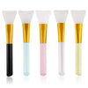 A set of six silicone facial mask brushes in various pastel colors, including white, light blue, pink, and yellow.