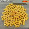 A pile of 100 small gold permimmon decorative ornaments, approximately 0.6cm long and 1.1g each.