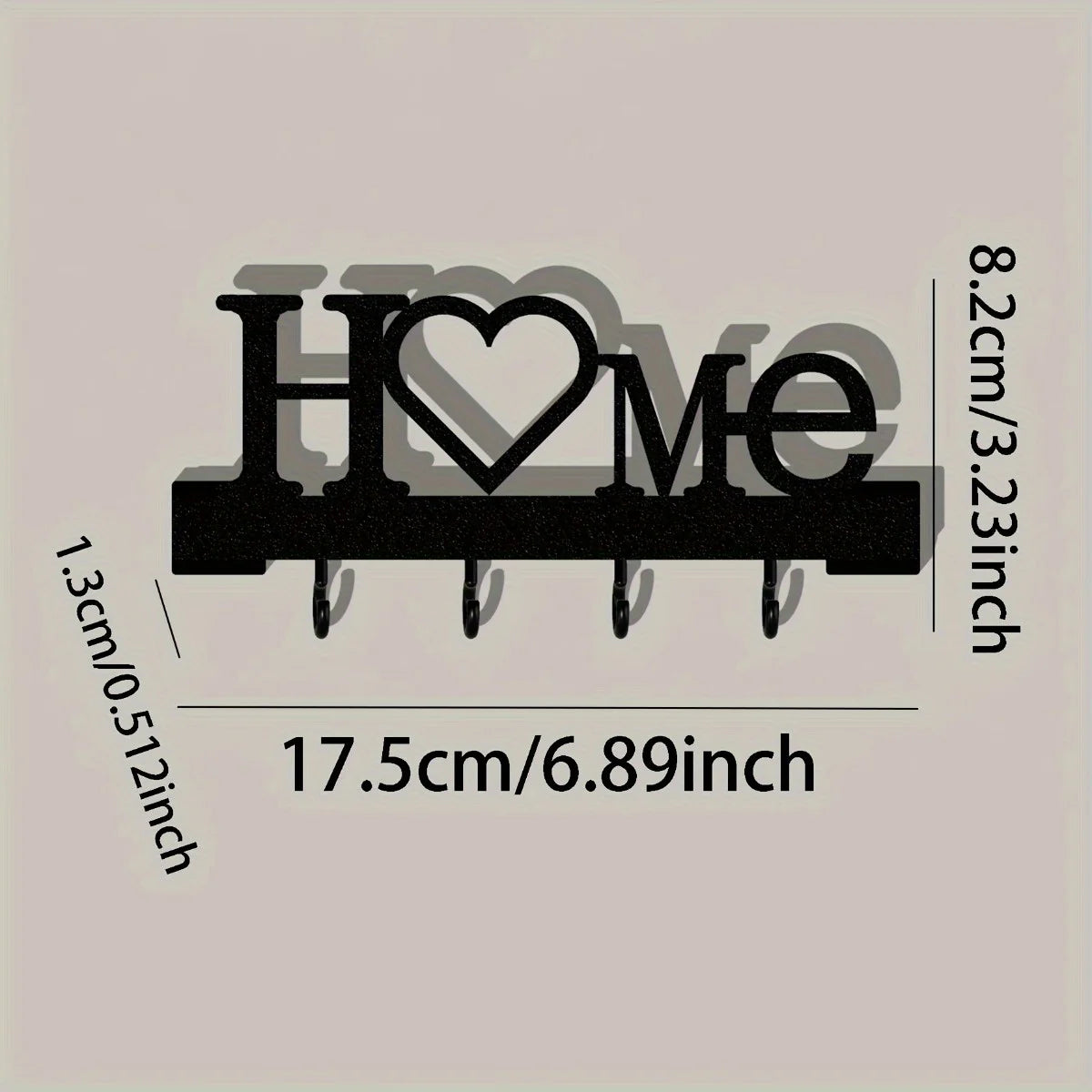 Rustic iron key holder wall art with the word Home and a heart carved into it, measuring 17.5cm long.