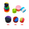 A collection of colorful silicone storage jars in various sizes, including 5ML, 3ML, and 2ML.