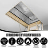 A triangular silver foil barrier installed under an attic roof structure, featuring thick and durable qualities.