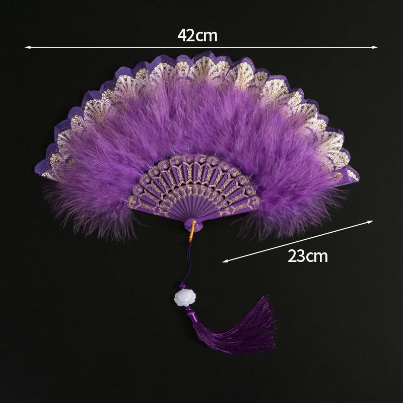 Purple lace fabric folding hand fan with a feathered edge and tassel