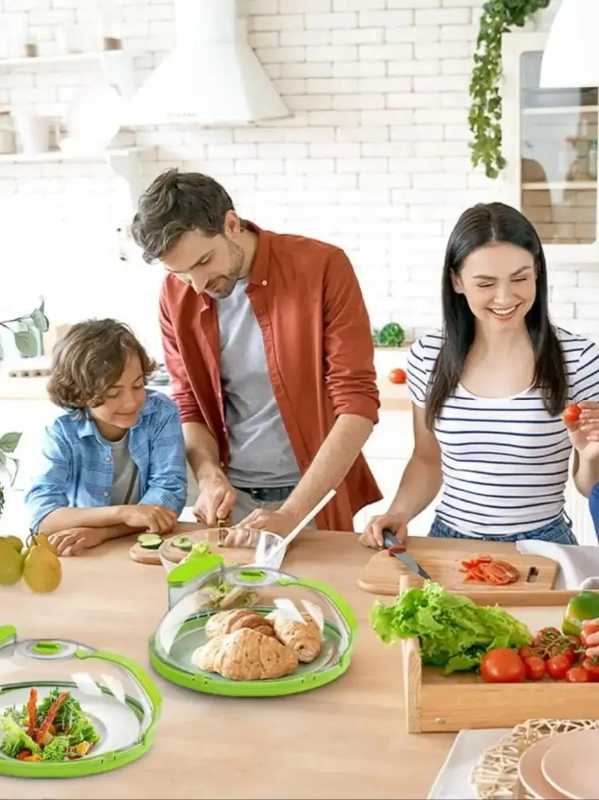 A woman and a boy are preparing food on a wooden table using a clear microwave splatter cover with a water steamer.