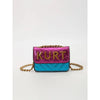 A pink and blue magnetic crossbody bag with a gold chain and letter flap.