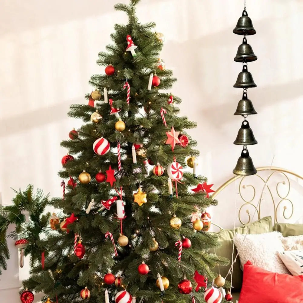 A decorated Christmas tree adorned with red and gold ornaments and silver ribbons.