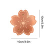 A copper bird bath disk with a floral design and triple-point support, measuring 10cm by 3.9in.
