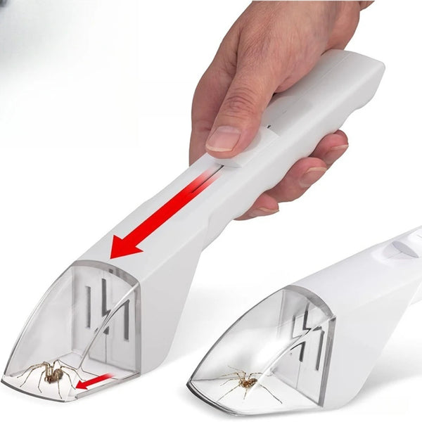 A hand is holding a white handheld pest catcher device, showing the clear plastic collection area.