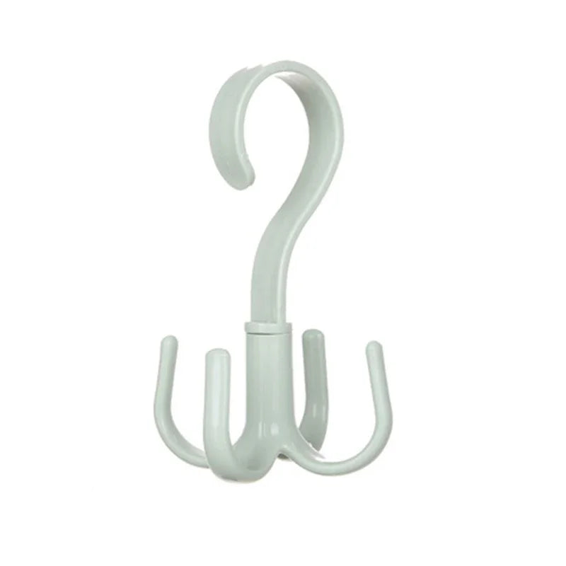 A white space-saving rotating closet organizer hook with a curved handle and mounting base.