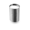 A cylindrical stainless steel bar measure with a white liquid inside.