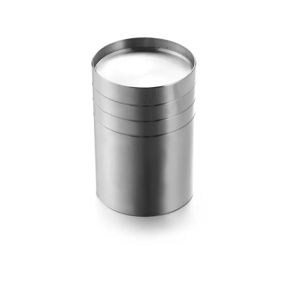 A cylindrical stainless steel bar measure with a white liquid inside.