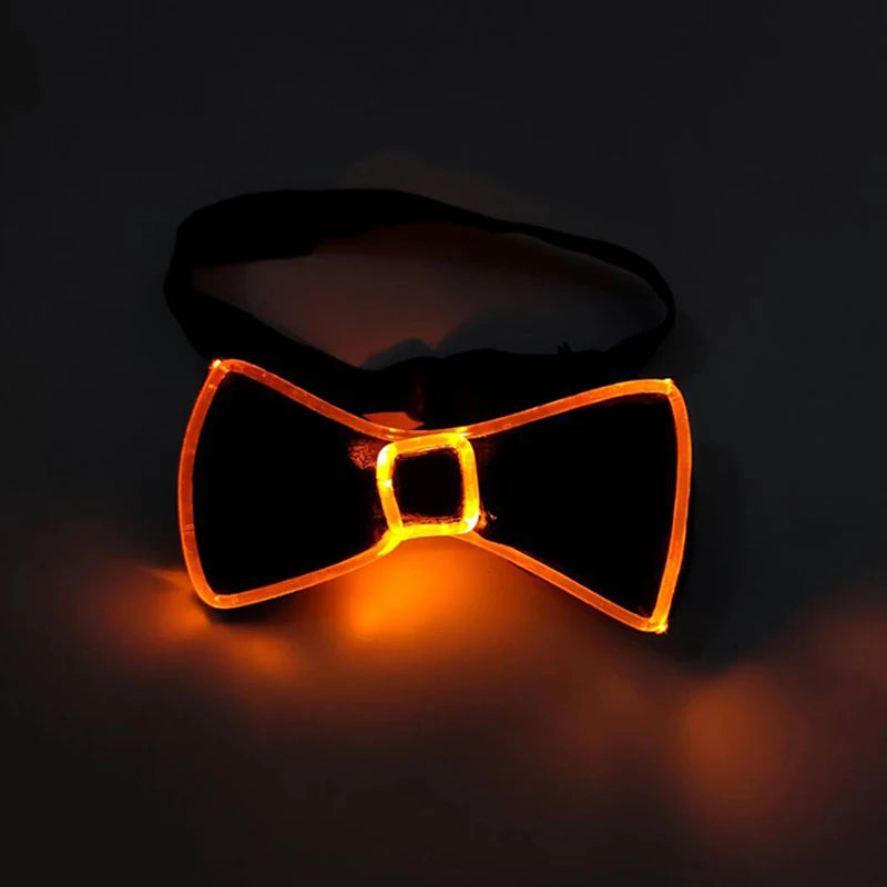 A pair of orange LED light up anime glasses glowing brightly against a dark background.