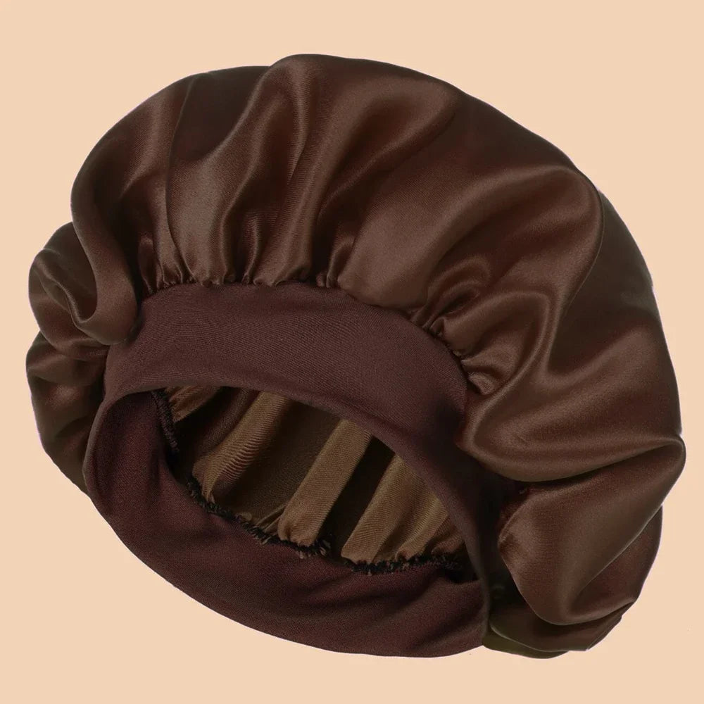 A dark brown satin wide brim shower cap folded and displayed on a neutral background.