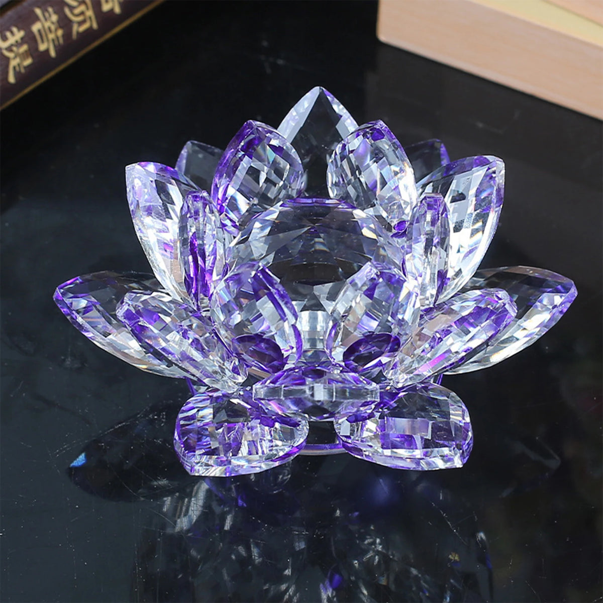 A clear purple crystal lotus flower centerpiece used as tabletop decor.