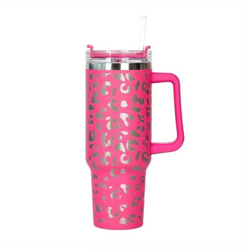 A pink leopard print insulated stainless steel tumbler with a silver lid and straw.