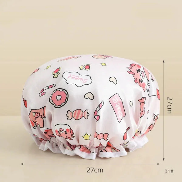 A pink reusable waterproof shower cap for hair care shown flat and round.