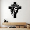 Black metal cross wall art featuring a bearded face and crown design mounted on a white wall.