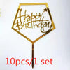 Gold acrylic birthday cake topper with glitter text and star design on a stick