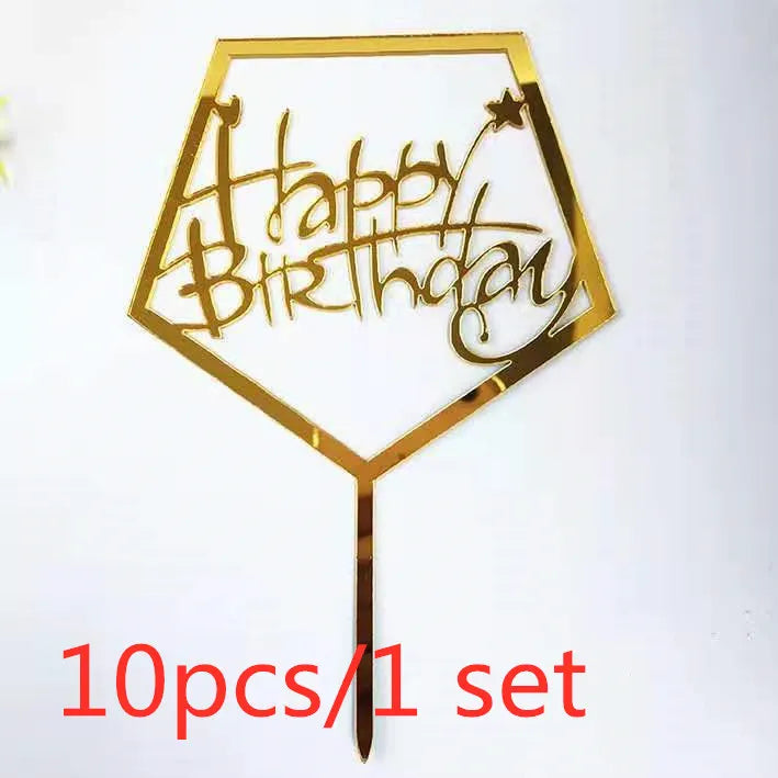 Gold acrylic birthday cake topper with glitter text and star design on a stick