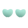 A pair of light mint green silicone heart-shaped charm beads for DIY jewelry.