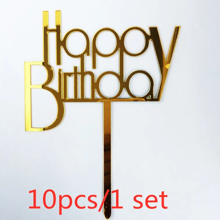 A set of ten gold acrylic birthday cake toppers spelling out Happy Birthday