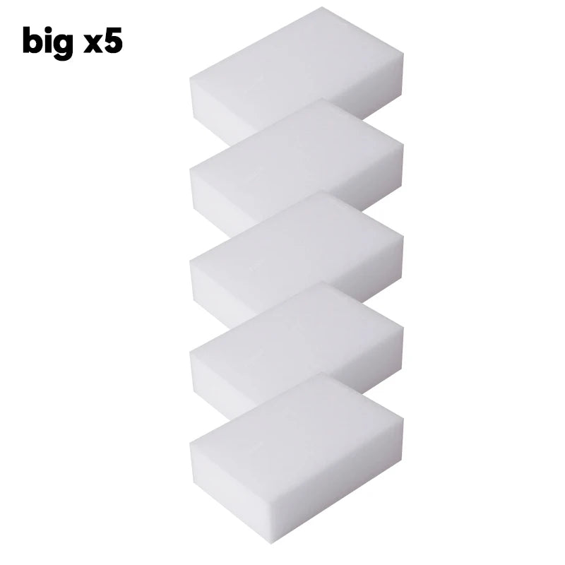 Five white melamine cleaning sponges or magic erasers stacked vertically.