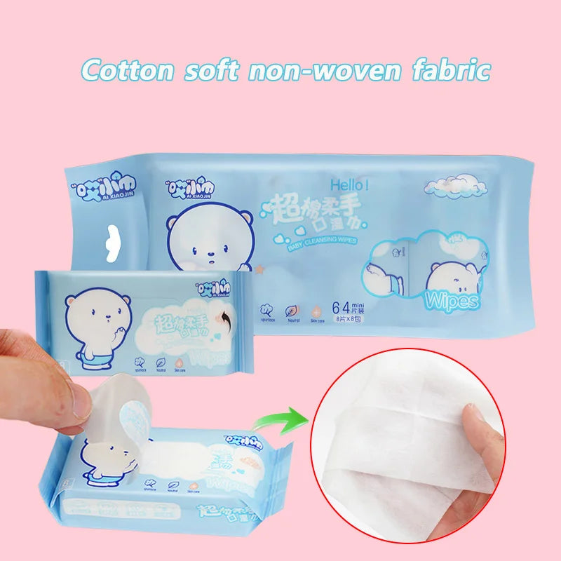 A package of cotton soft non-woven fabric wipes is shown next to a hand, with a close-up view of the white wipe material.