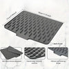 A gray silicone dish drying mat featuring raised drainage ridges and a non-slip surface.