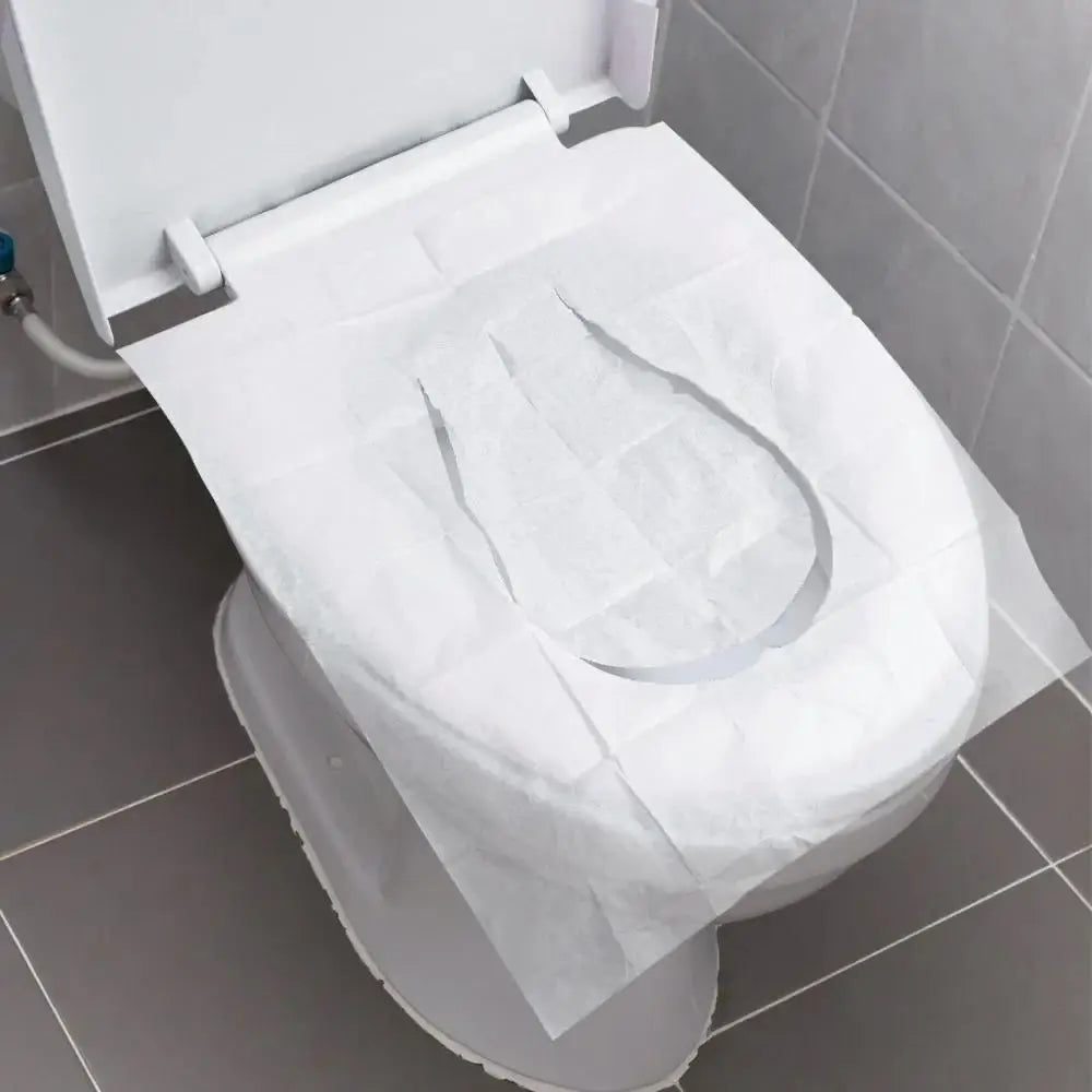 A white portable disposable toilet seat cover is shown on a toilet bowl.