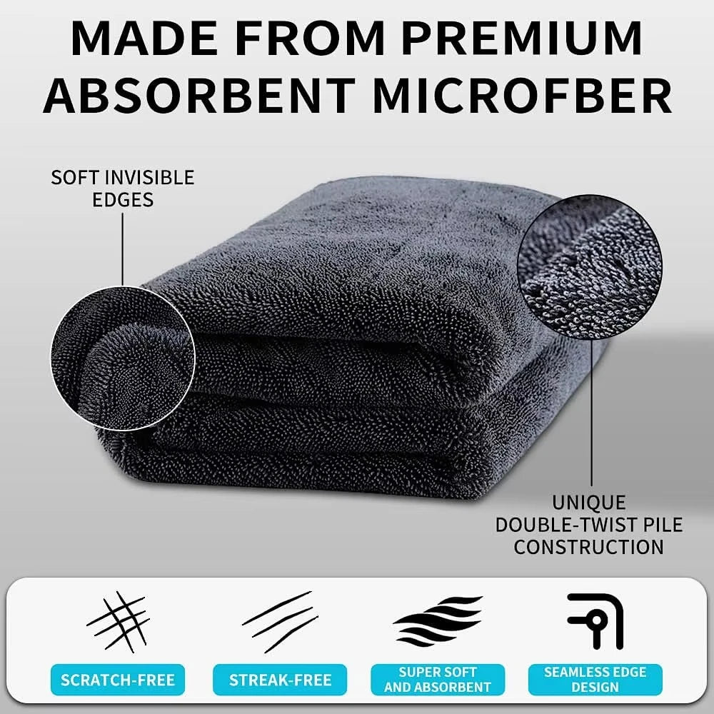 A stack of dark gray microfiber cleaning towels with a unique double-twist pile construction and scratch-free design.