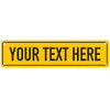 A yellow rectangular sign with black text that reads YOUR TEXT HERE.