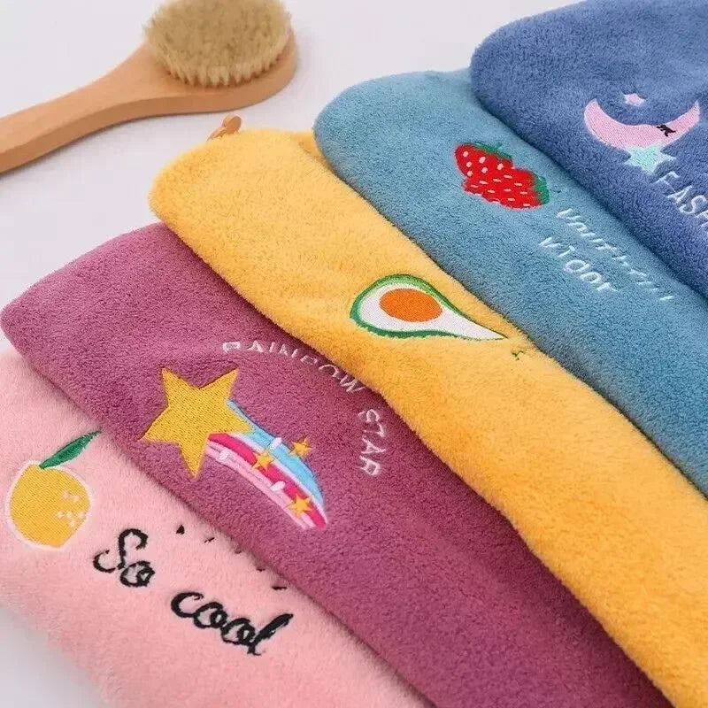 A collection of colorful soft absorbent hair towels featuring various designs like strawberries, avocados, lemons, and stars.