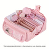 Pink multi-compartment pencil case organizer with various stationery and stickers inside