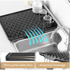 Silicone dish drying mat with raised drainage ridges shown in a kitchen sink