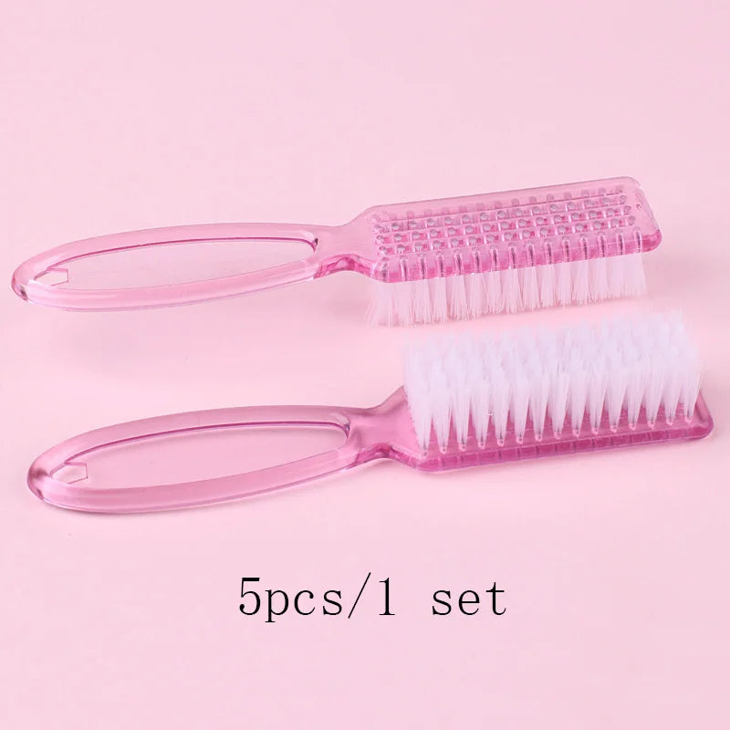 A set of five pink plastic brushes for nail art and dust cleaning