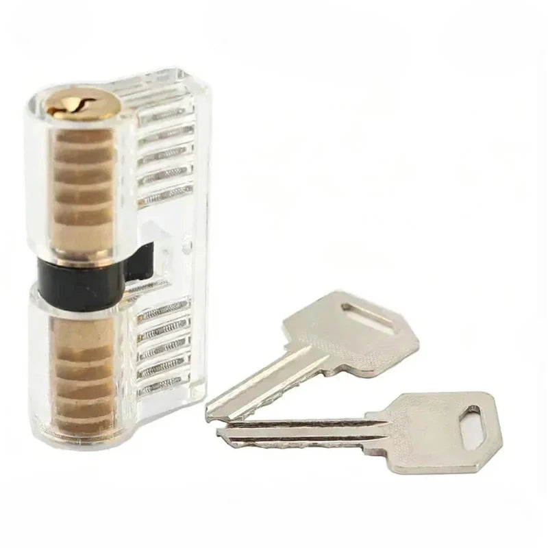 A clear plastic locksmith practice key with a metal blade and a corresponding silver key.