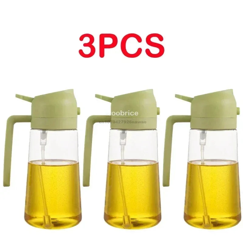 Three glass oil spray bottles with green caps and yellow cooking oil inside